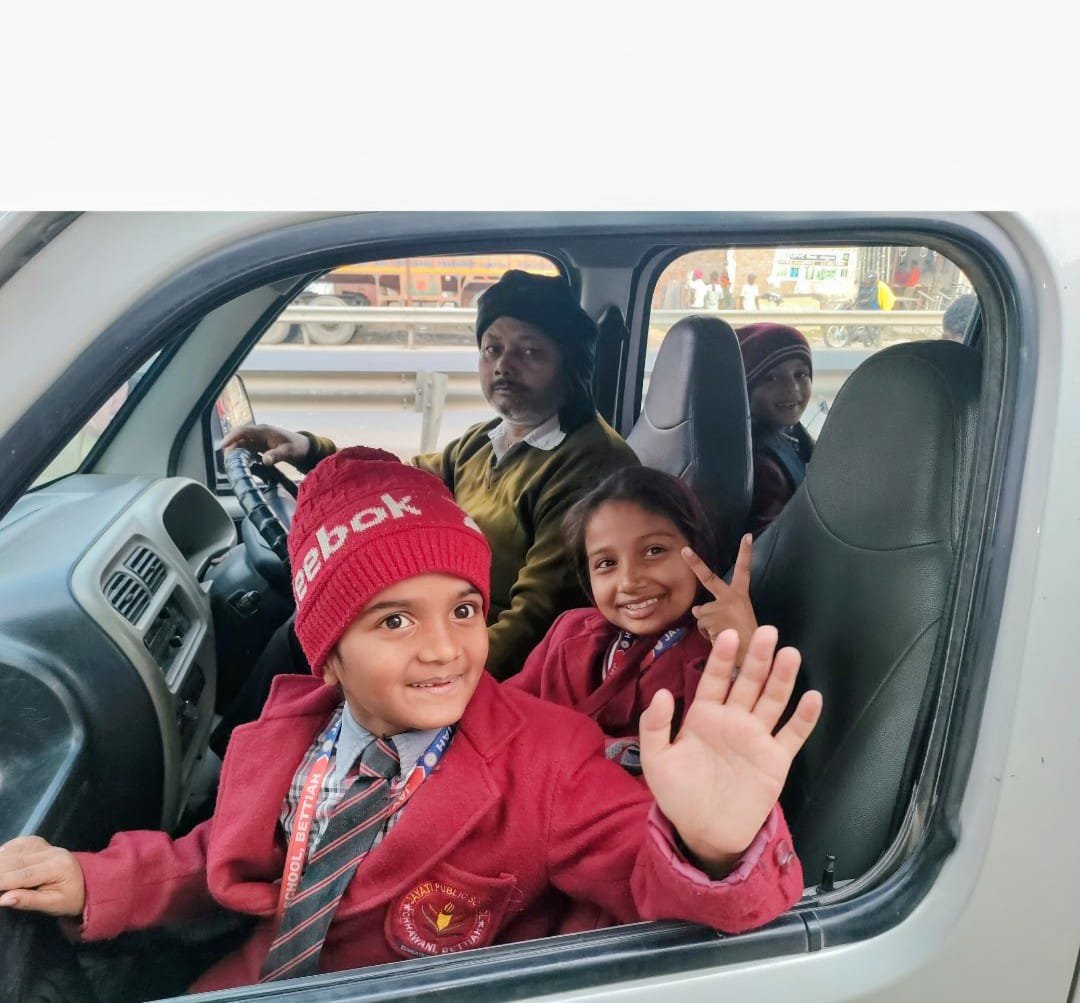 Students in school transport vehicle