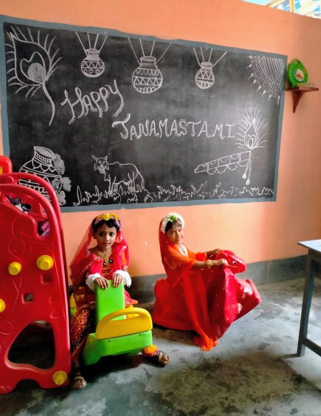 Children in Janmashtami dress up riding toy horses